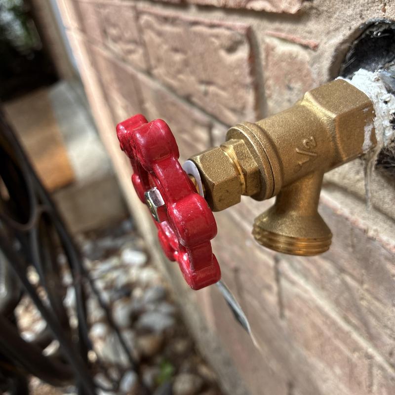 Front hose bib replacement with red valve handle