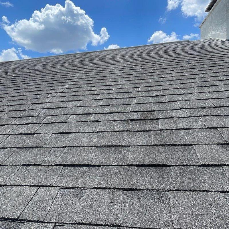 Shingle roof with aging and damaged areas