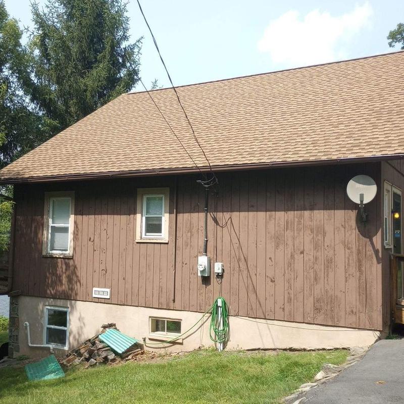 Asphalt shingle roof on residential home in Dingmans Ferry Asphalt shingle roof on residential home in Dingmans Ferry