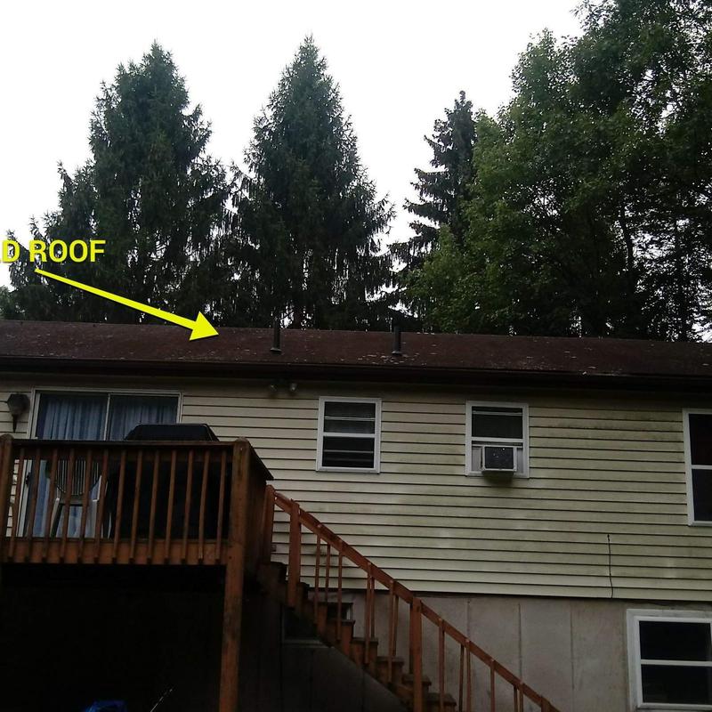 Asphalt shingle roof on residential home with deck and stairs Asphalt shingle roof on residential home with deck and stairs