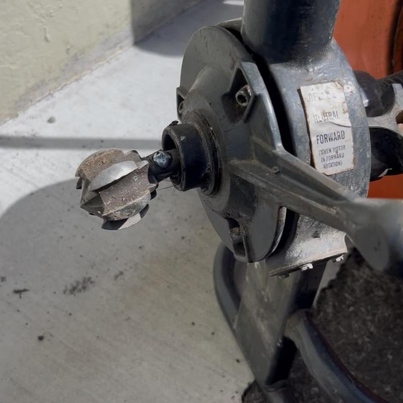 Grease main drain auger with cutting blade removed