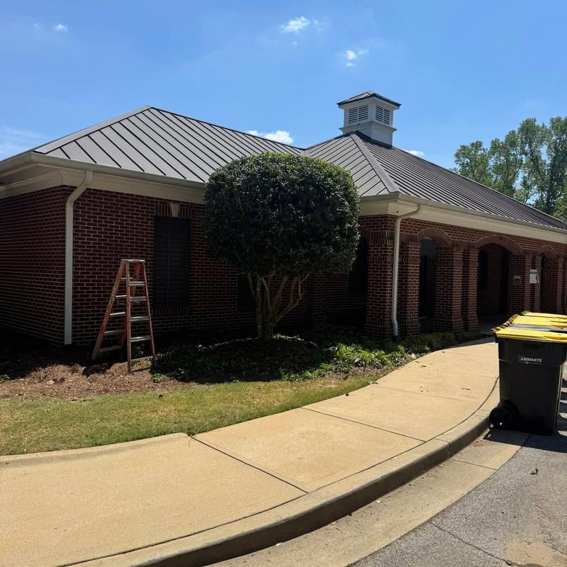 Metal roof on brick leasing office building in Woodstock