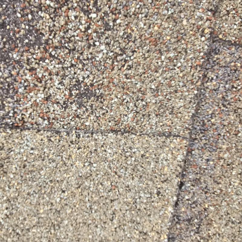 Asphalt shingle granule loss from hail damage