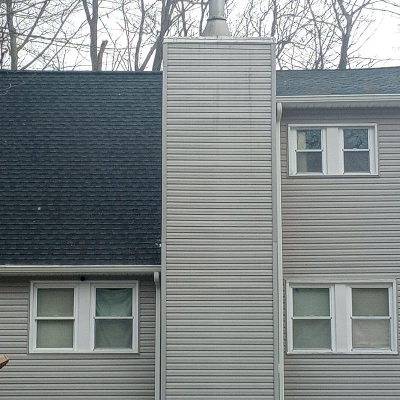 Asphalt shingle roof with vinyl siding chimney exterior Asphalt shingle roof with vinyl siding chimney exterior