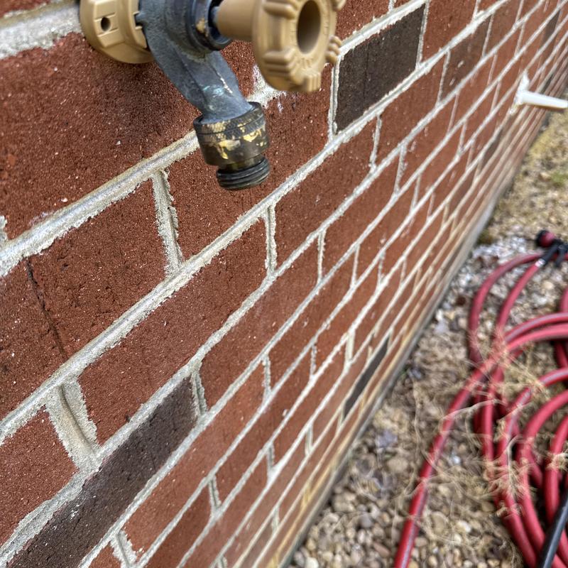 Frost proof hose bib on brick exterior wall