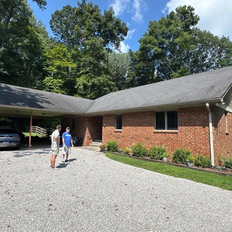 Asphalt shingle roof with hail damage inspection