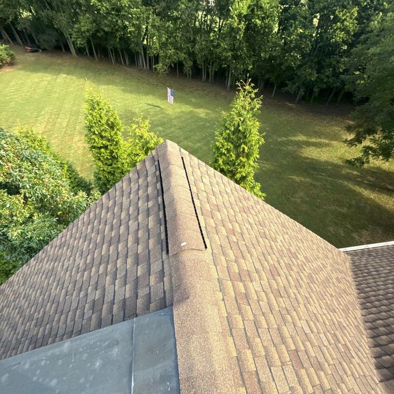 Roof ridge vent with shingle installation detail