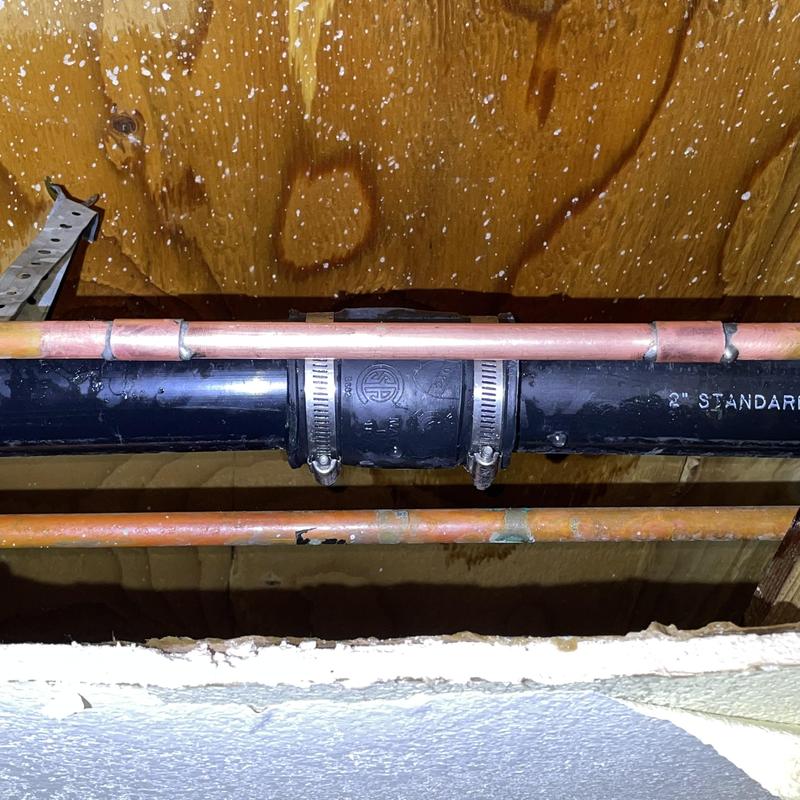 Copper water line with soldered fittings and clamps