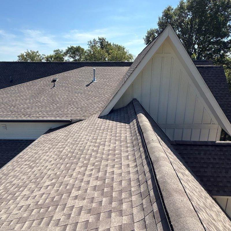 Asphalt shingle roof with ridge and valley sections