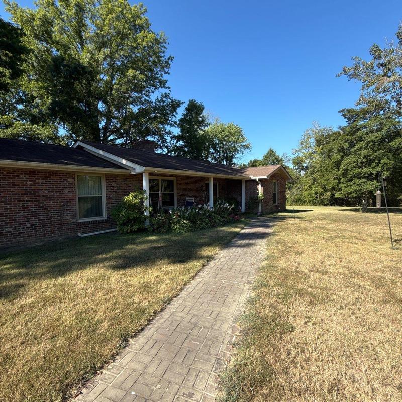 Asphalt roof hail damage inspection at brick home