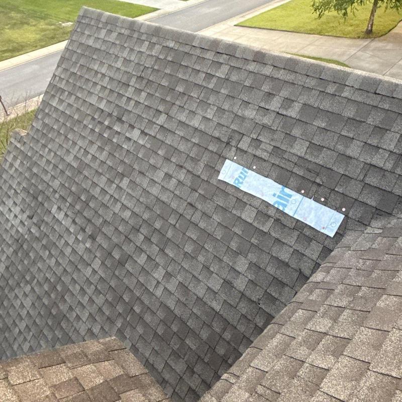 Asphalt shingle roof with hail damage inspection patch