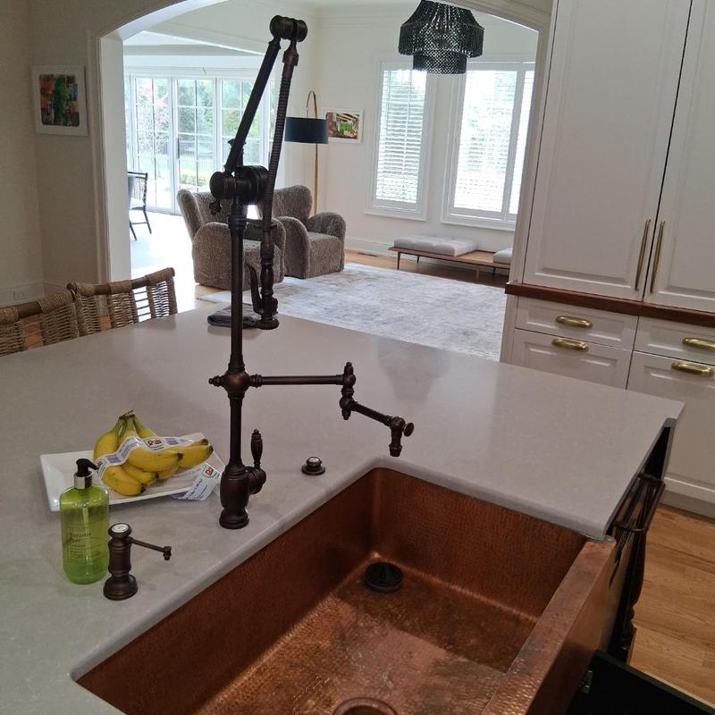 Copper kitchen sink with bronze faucet installation