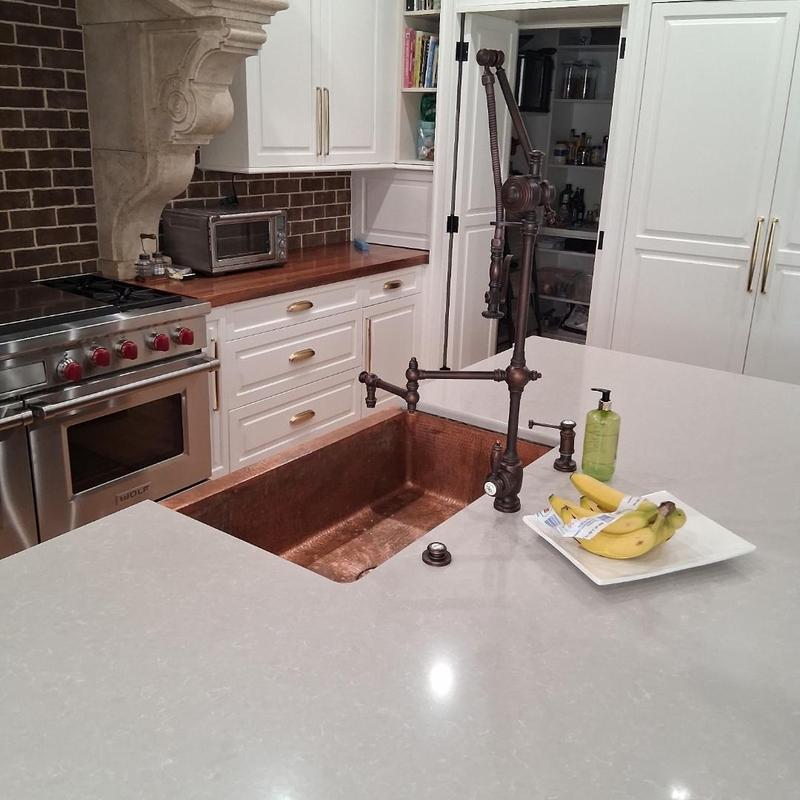 Copper kitchen sink with vintage faucet installation