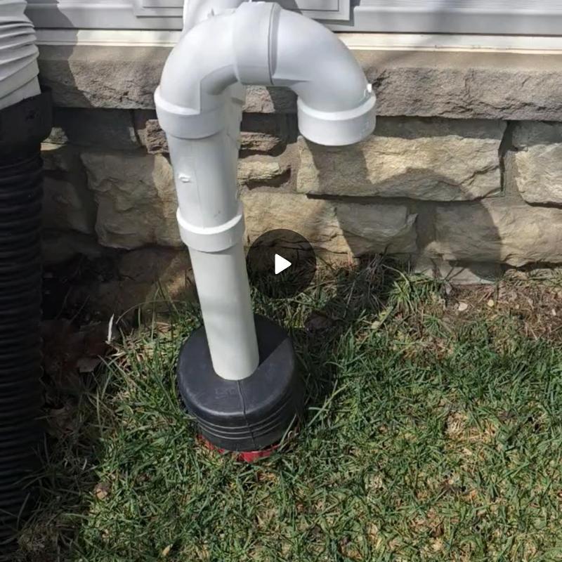 Cast iron sump pump discharge pipe outside home