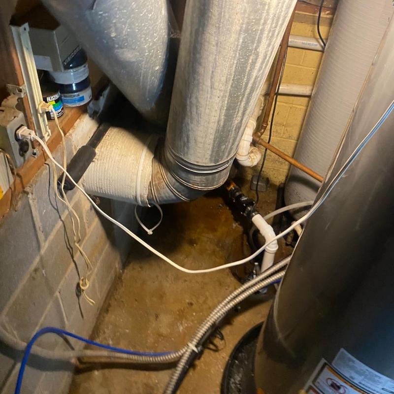 Sump pump replacement with surrounding plumbing setup