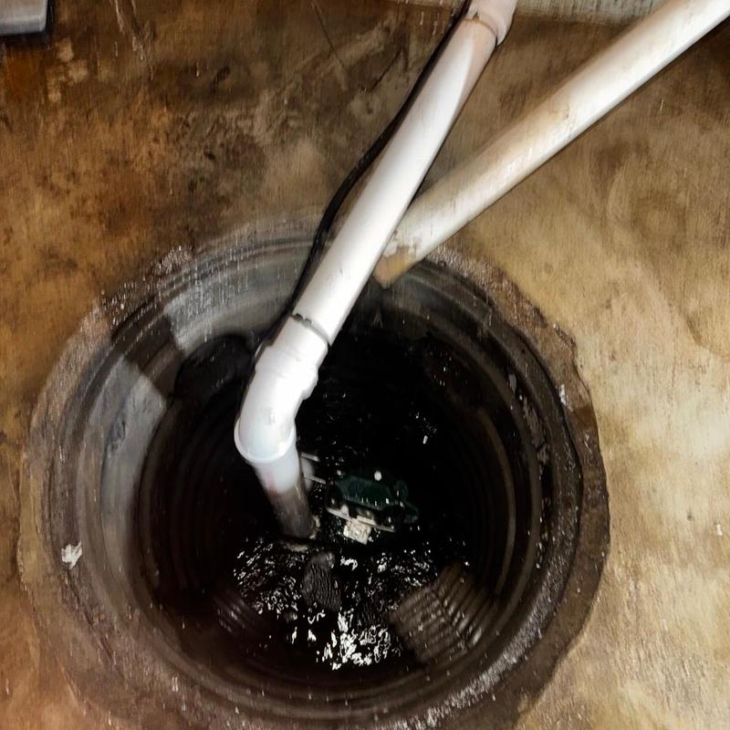 Zoeller M53 sump pump with PVC discharge pipes