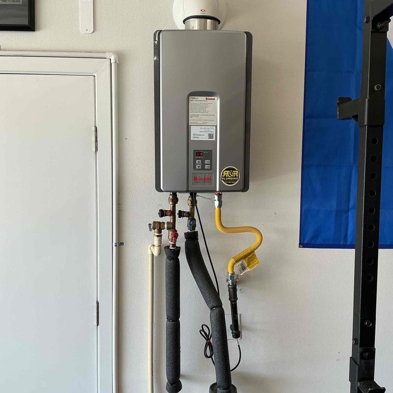 Tankless water heater with insulated supply lines