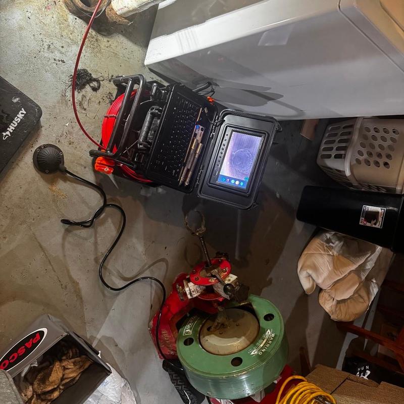 Main drain snake machine with inspection camera display