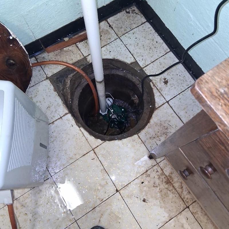 Sump pump system inside basement floor drain
