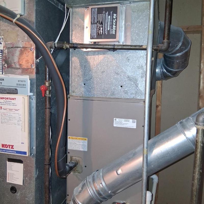 Gas furnace with ductwork and piping connections