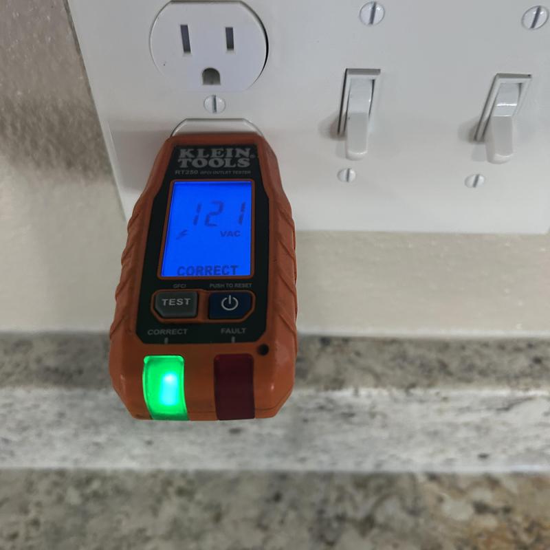 Electrical outlet tester showing correct wiring and voltage