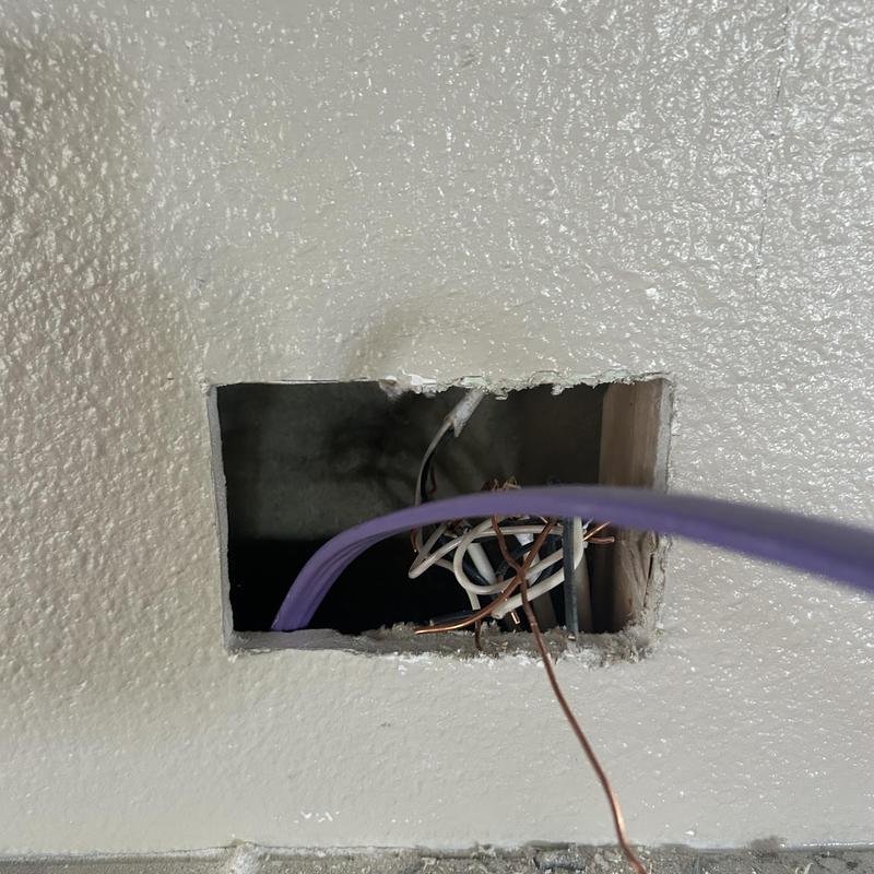 Garbage disposal electrical wiring in wall opening