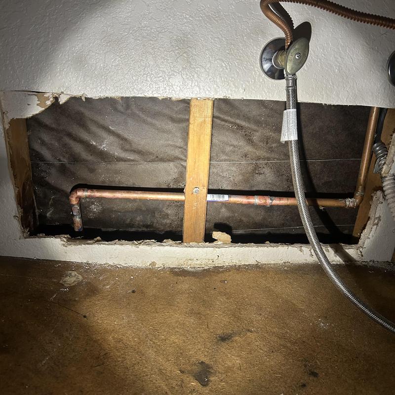Copper waterline inside kitchen wall with drywall removed