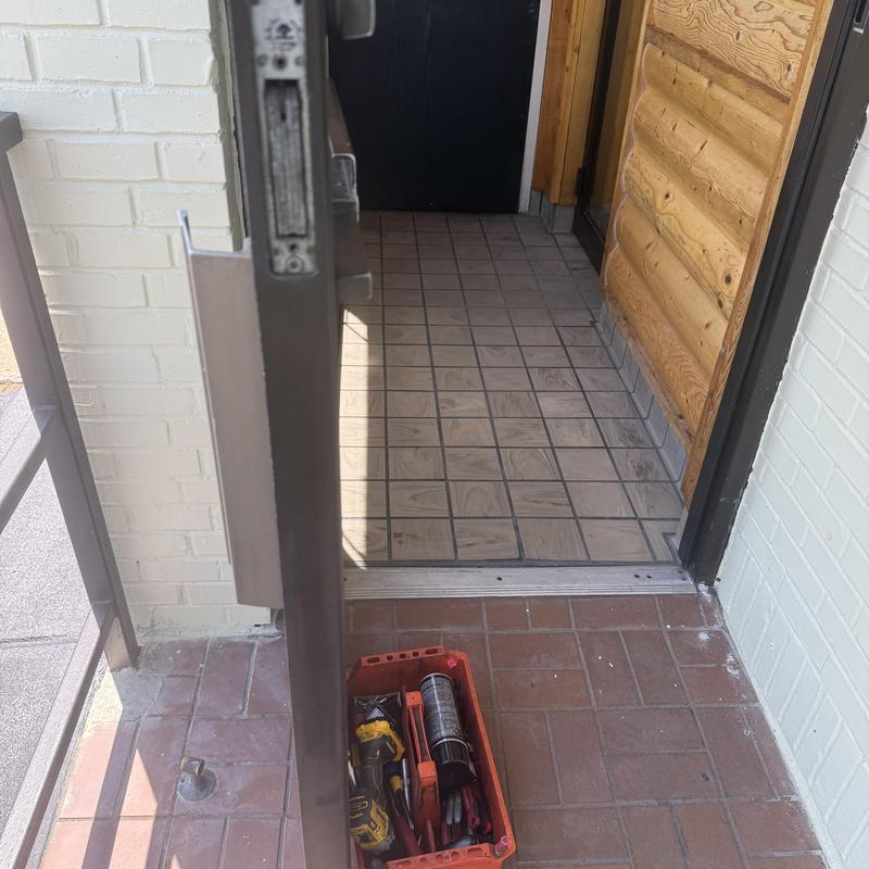Metal door lock rekeying with tools in box