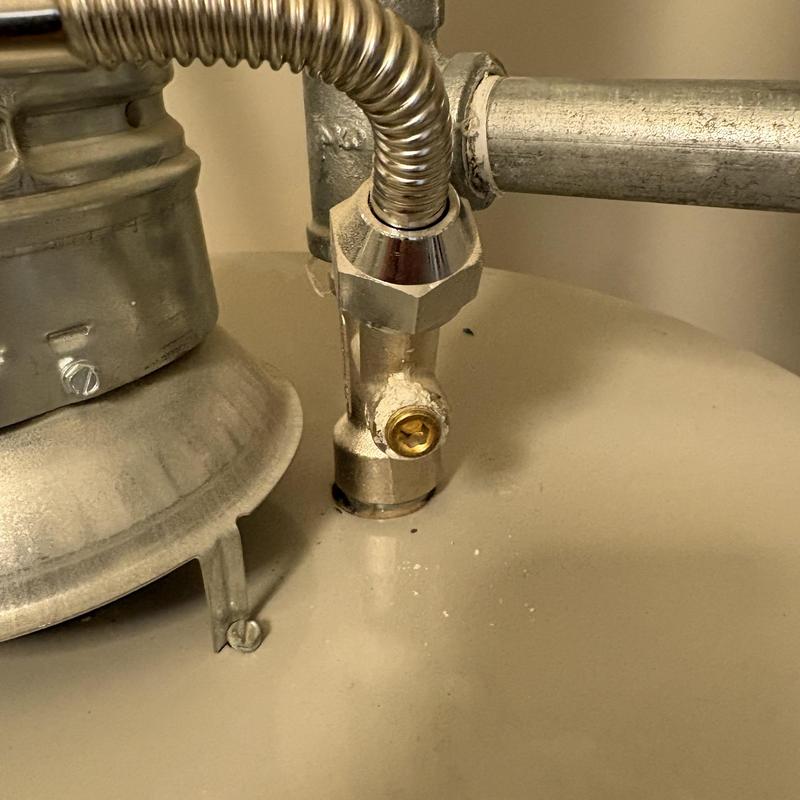 Water heater gas valve and connector close-up