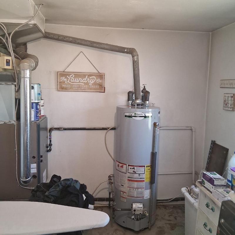 Water heater with exhaust vent in utility room