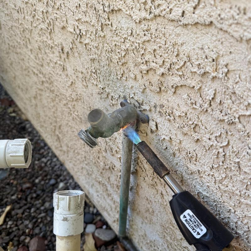 Outdoor water spigot heating with torch in Goodyear, AZ Outdoor water spigot heating with torch in Goodyear, AZ