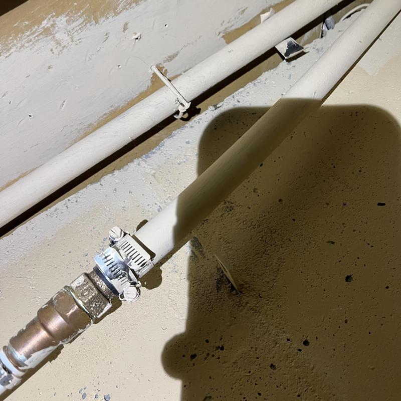 PEX water piping with metal connector and clamp installation