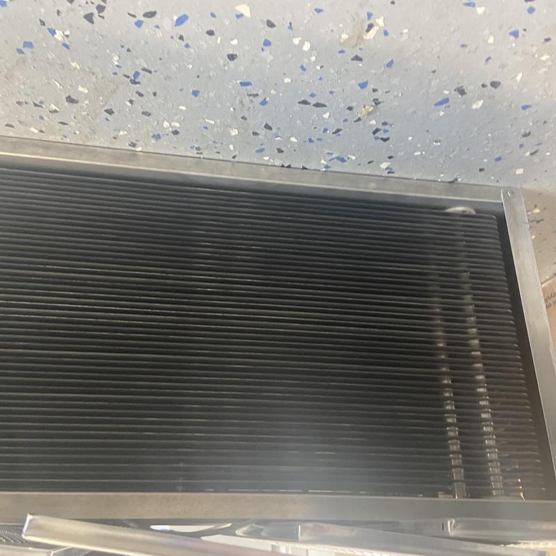 Outdoor HVAC condenser coil after rinsing