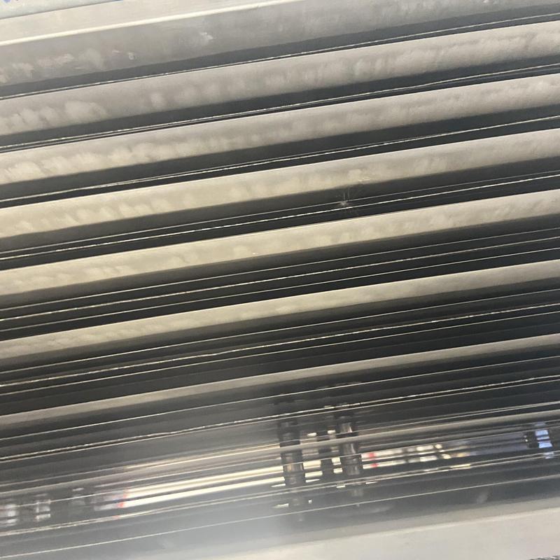 Outdoor HVAC condenser coils during biannual inspection