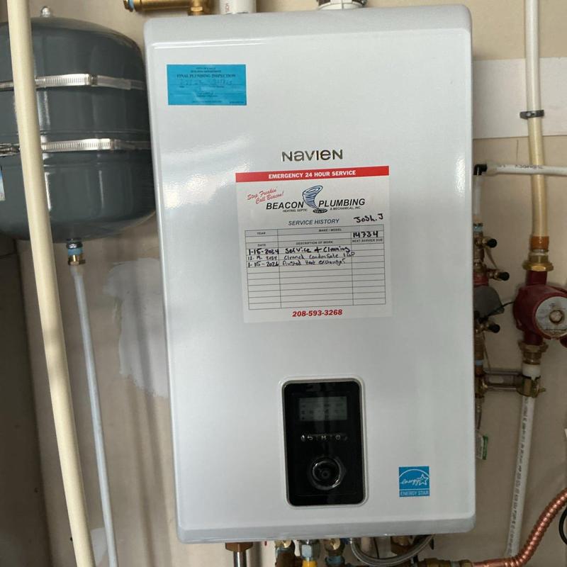 Navien tankless water heater with service history label