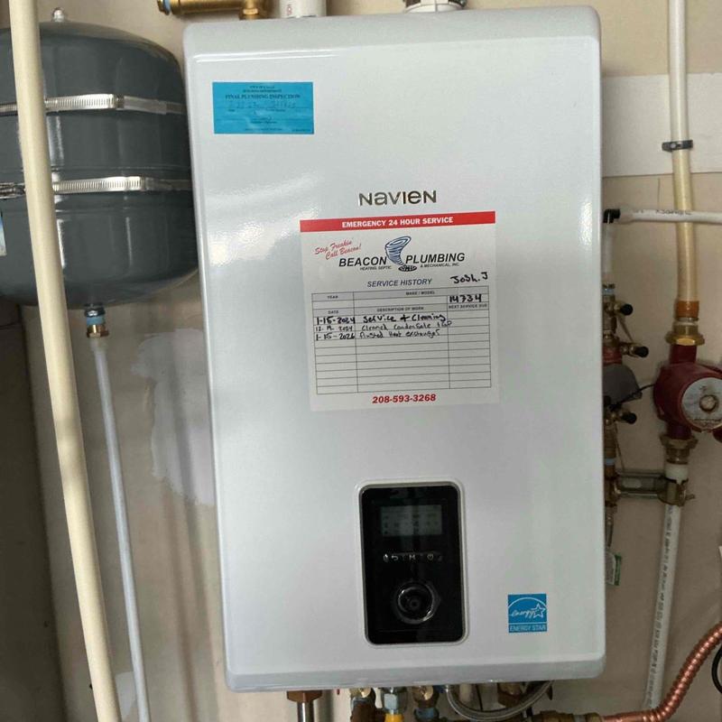 Navien tankless water heater with service history label