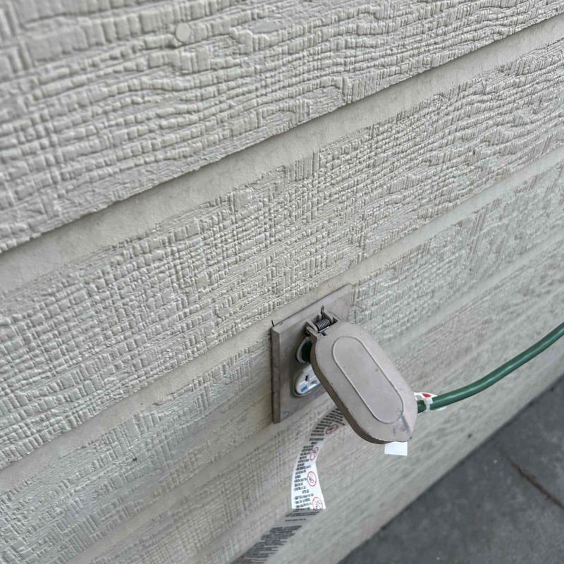 Exterior electrical receptacle with weatherproof cover installed