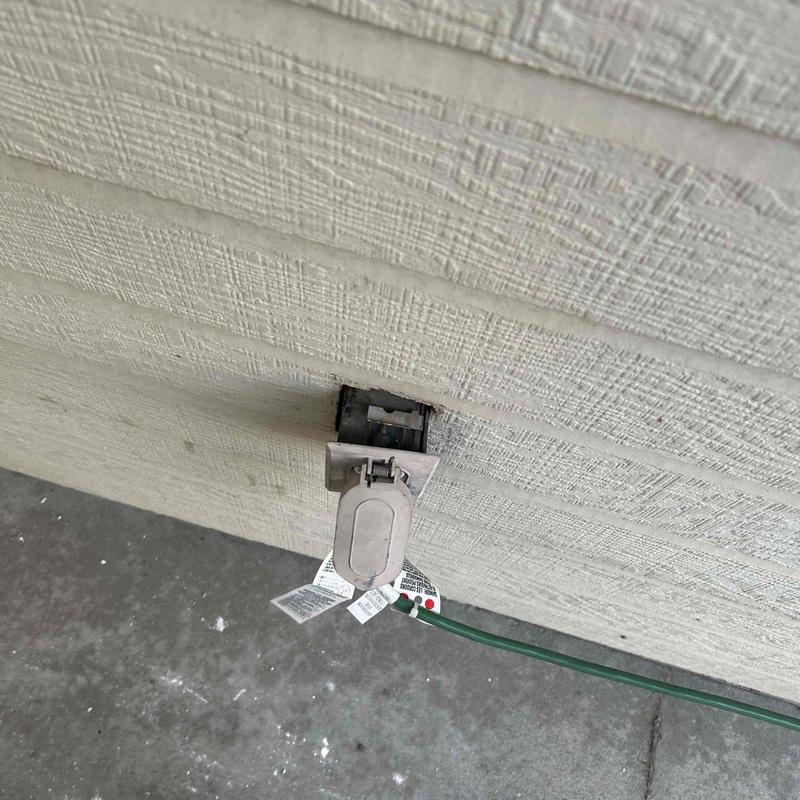 Outdoor electrical receptacle with protective cover installed