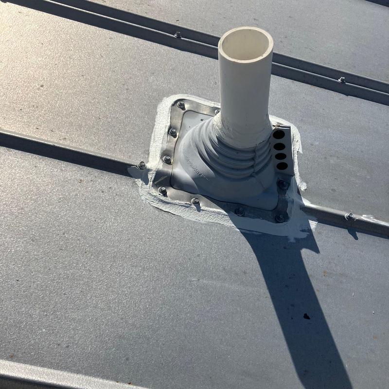 Pipe penetration pipe boot sealing on metal roof