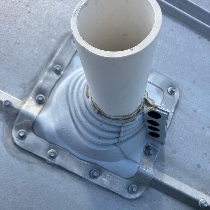 Pipe penetration with metal pipe boot on roof system