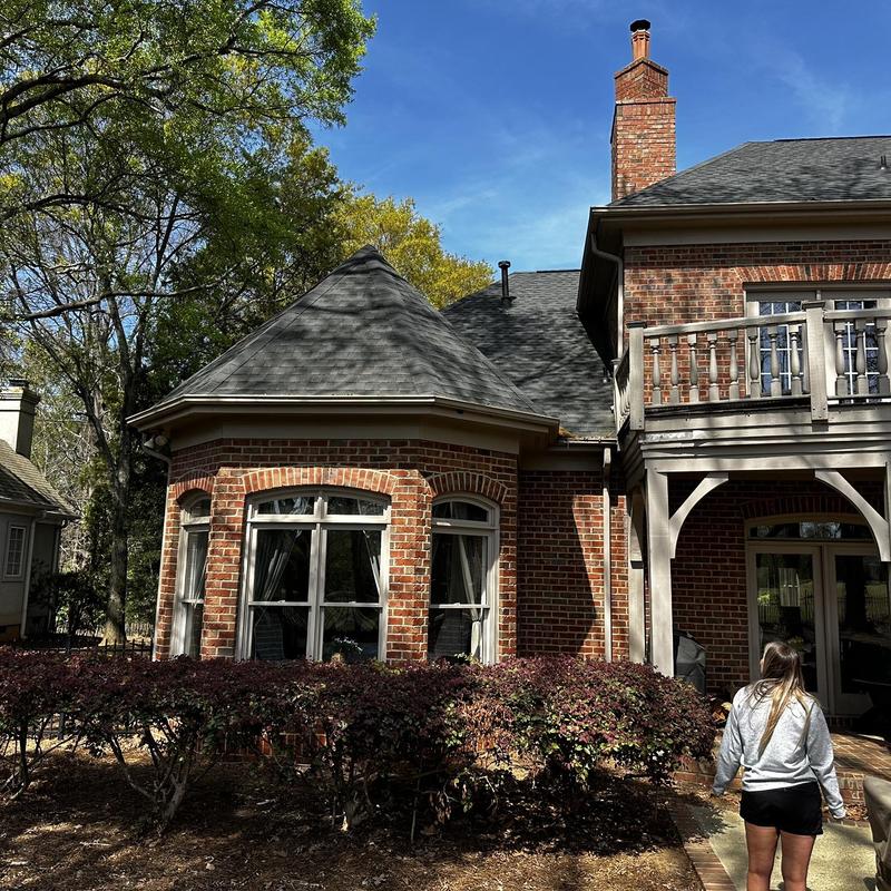 Painted gutters with new gutter guards on brick home