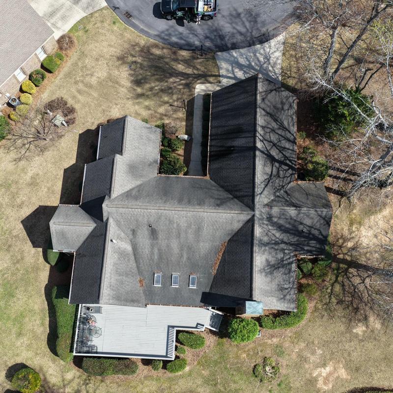 Asphalt shingle roof with storm damage inspection