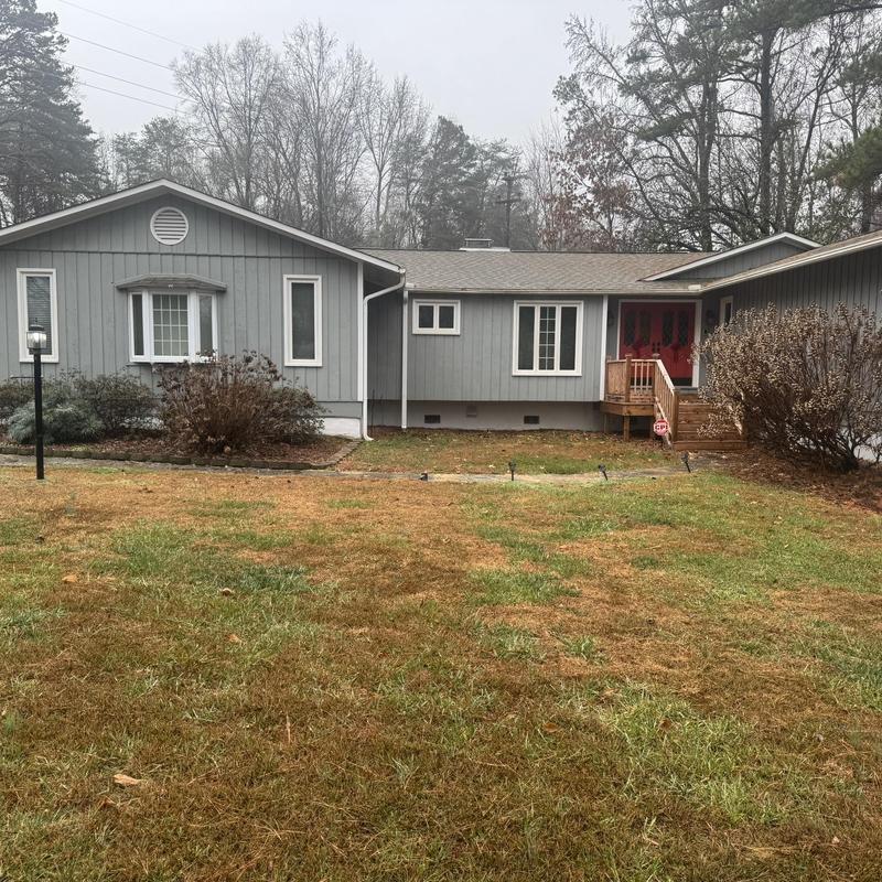 Asphalt shingle roof with minor damage and gutters