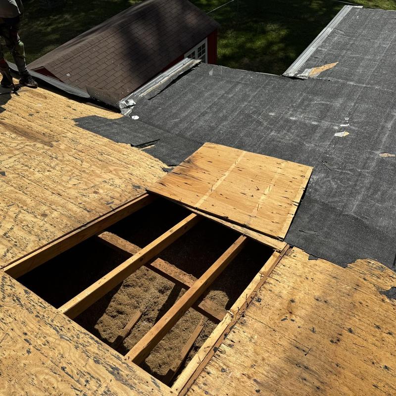 Wood roof decking replacement with roll roofing removal