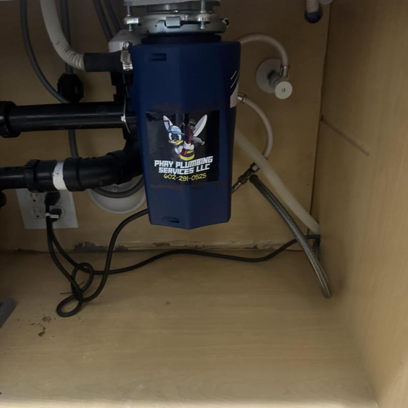 Garbage disposal unit installed under kitchen sink Garbage disposal unit installed under kitchen sink