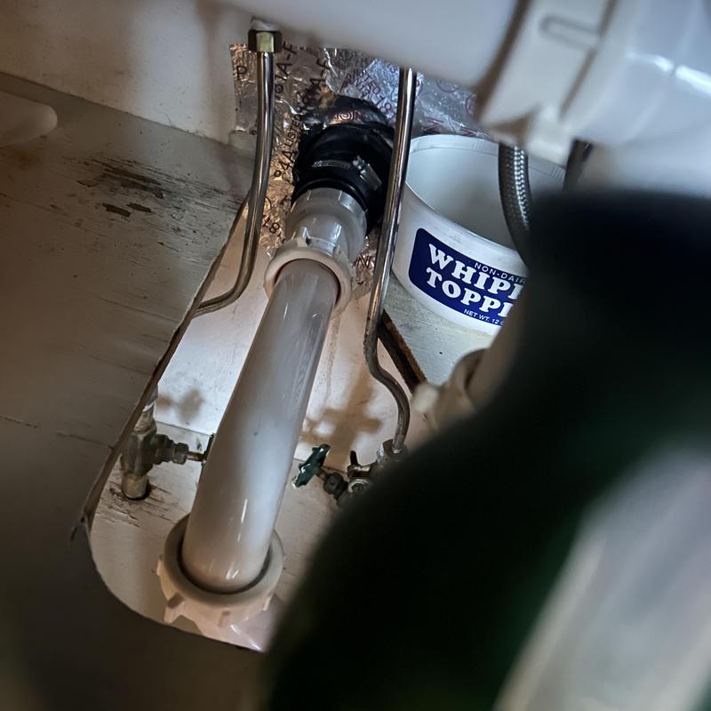 Floor drain pipe and valve connections under sink