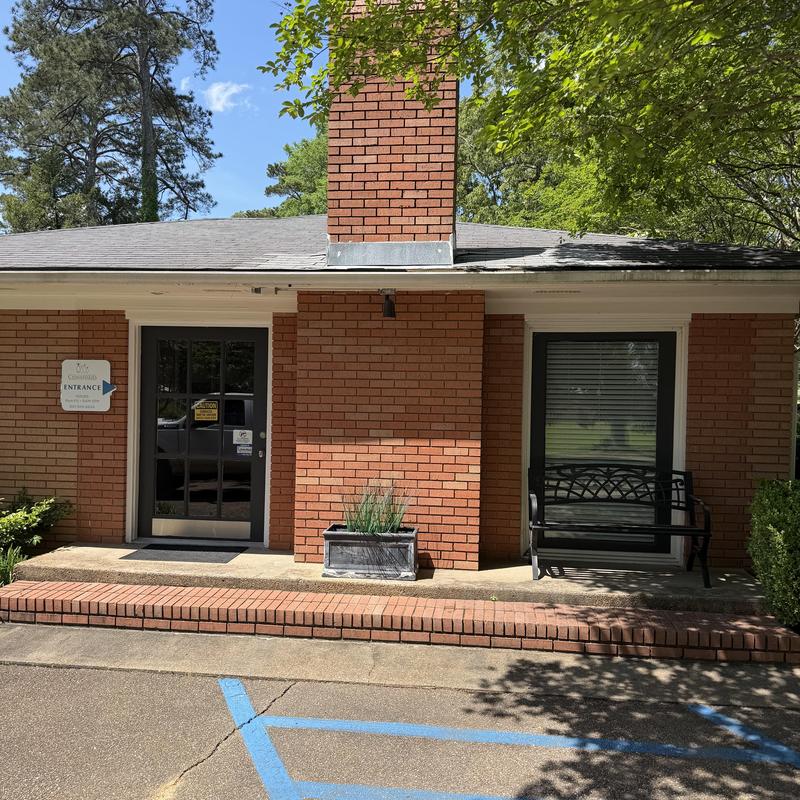 Asphalt shingle roof with chimney flashing repair