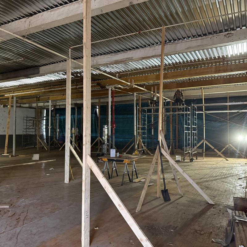 Metal roof decking with structural wood beam replacement