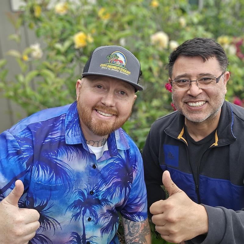 Electric water heater installation with smiling technicians