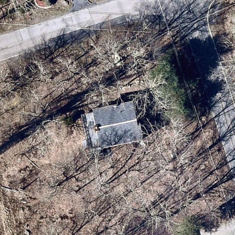 Asphalt shingle roof aerial inspection in wooded area Asphalt shingle roof aerial inspection in wooded area